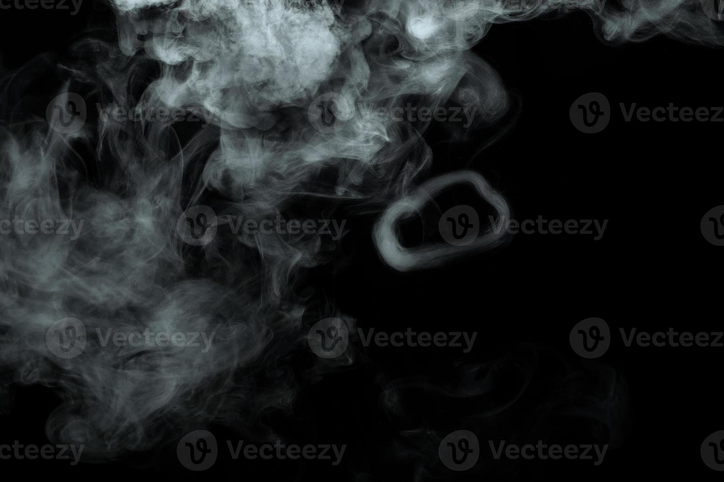 Abstract powder or smoke isolated on black background photo