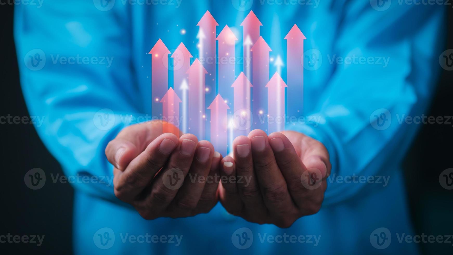 young businessman showing business growth icon in hand Ideas for developing business strategies and sustainable growth plans and stepwise financial management. photo