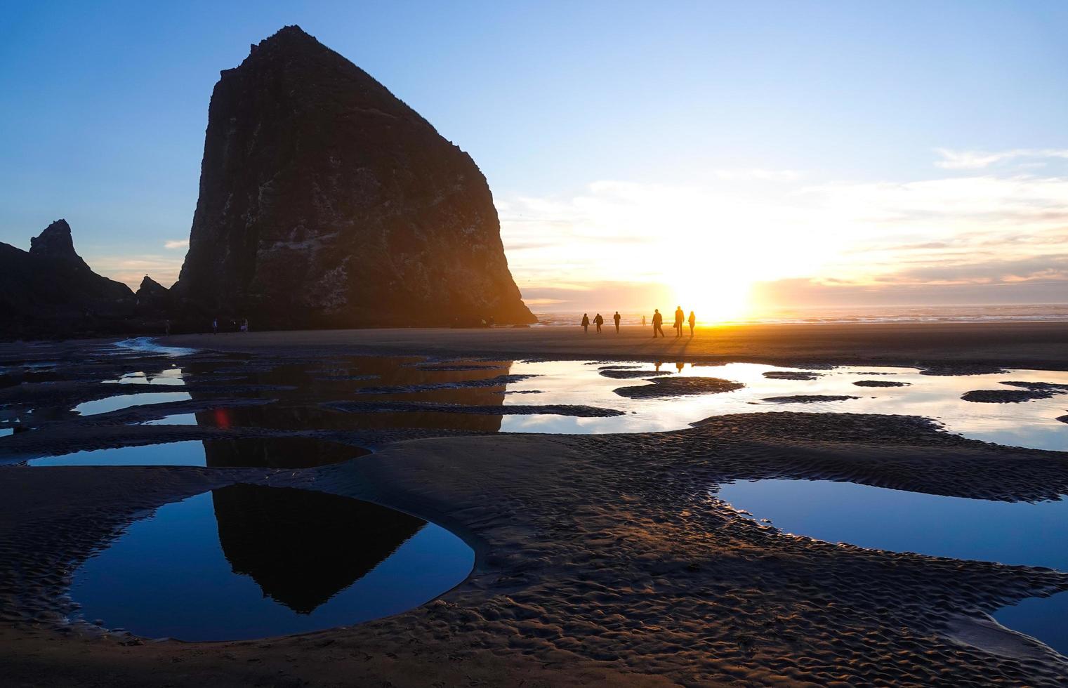 Catching sunset at Haystack Rock in Cannon Beach, Oregon. photo