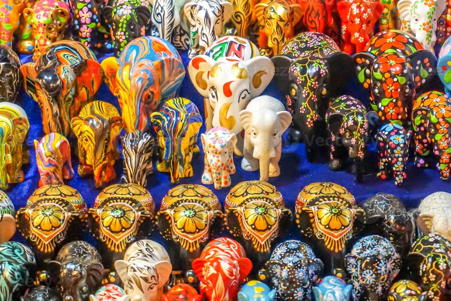 Closeup fancy and colorful pattern miniature plaster elephant doll., sell in the market. photo