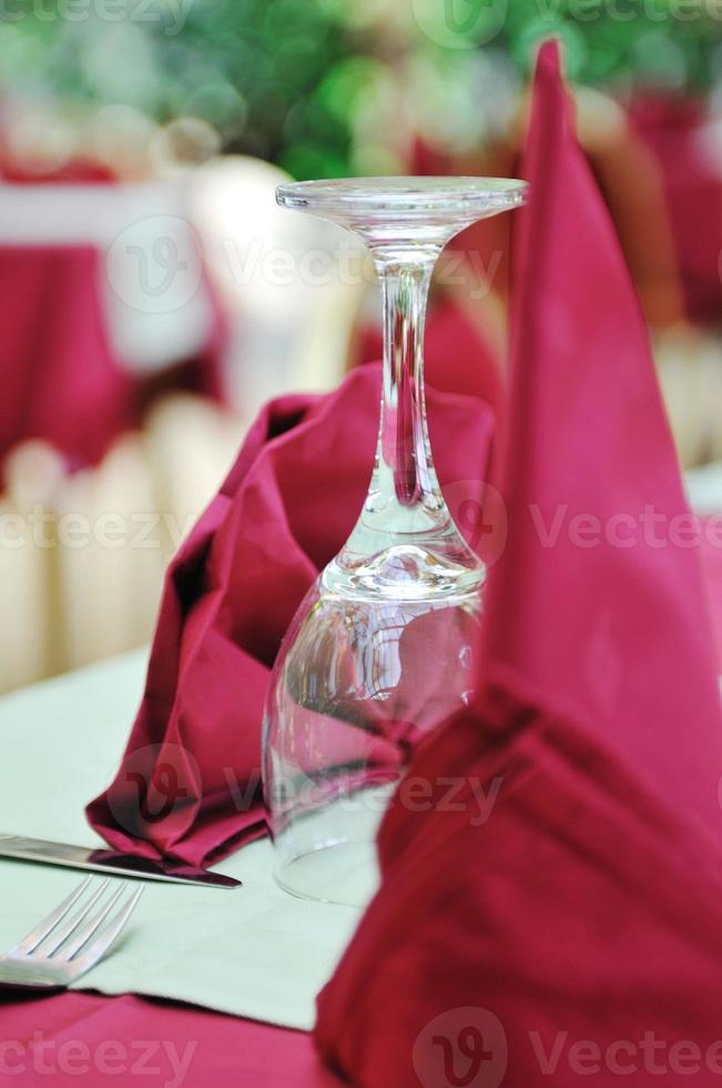 restaurant table with empty wine glass photo