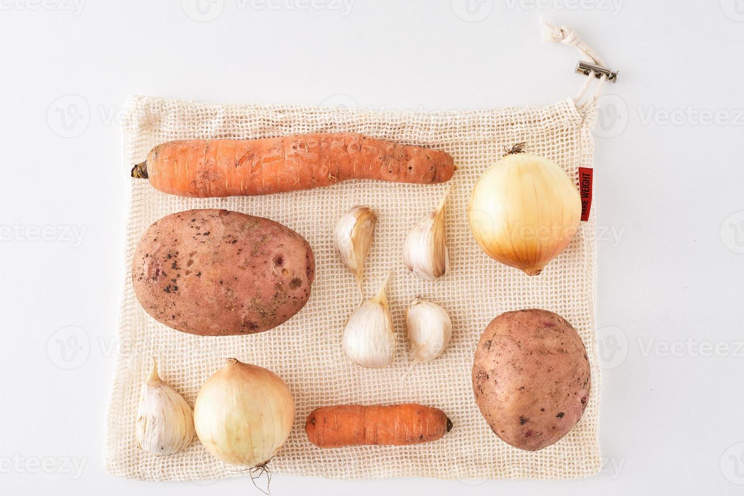 Set of fresh vegetables on a white background, top view photo