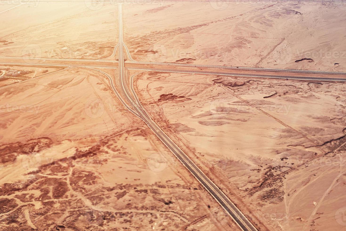 aerial view of highway road in a desert photo