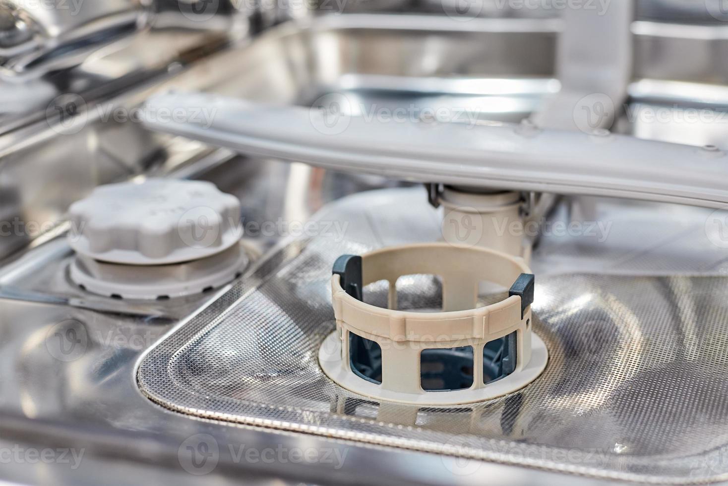 a dishwasher machine filter close up. Domestic kitchen appliance parts photo