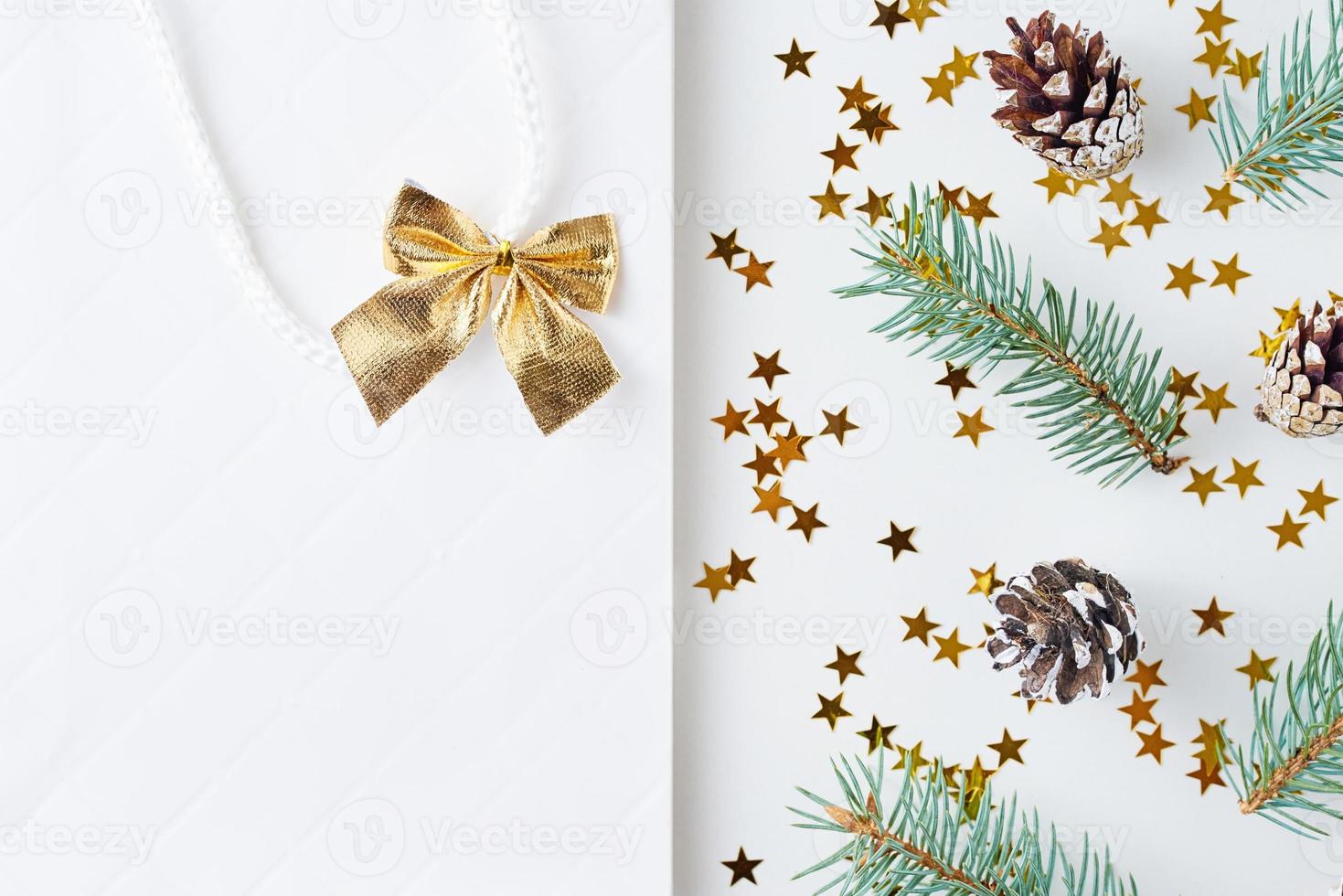 Christmas background made of pine cones and fir tree photo