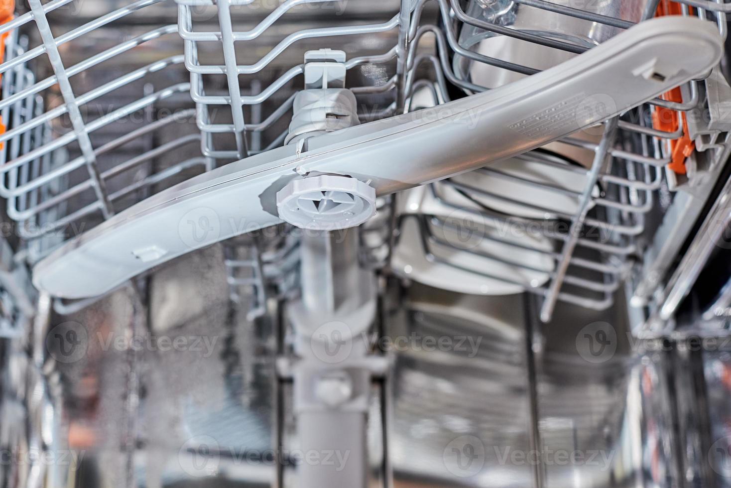 a dishwasher machine carriage close up. Domestic kitchen appliance parts photo