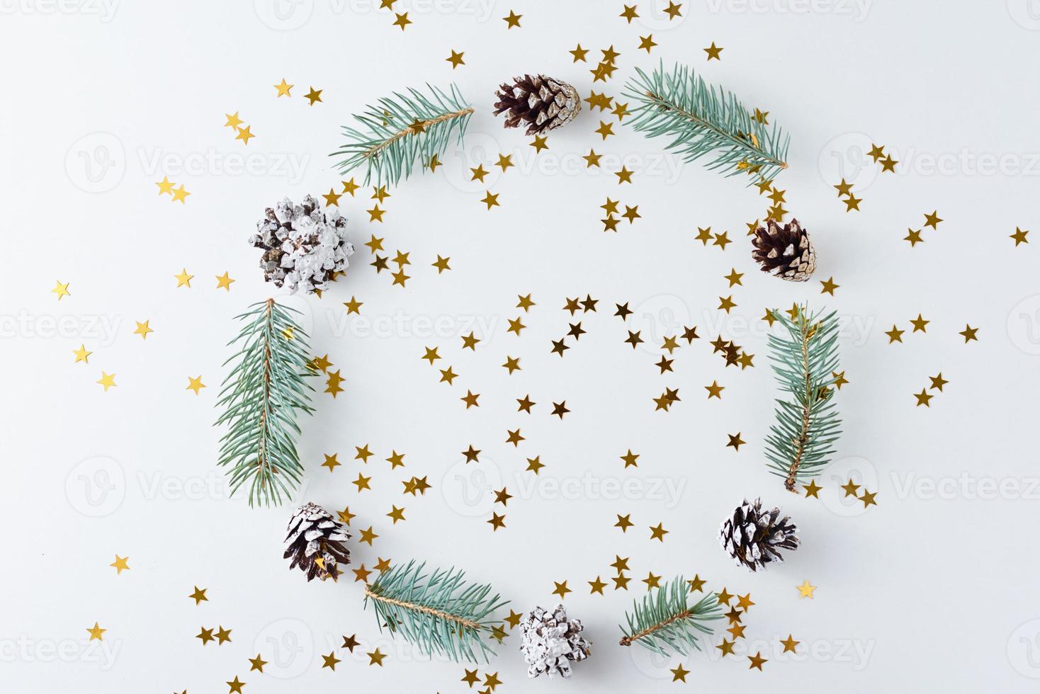 Christmas background made of pine cones and fir tree photo