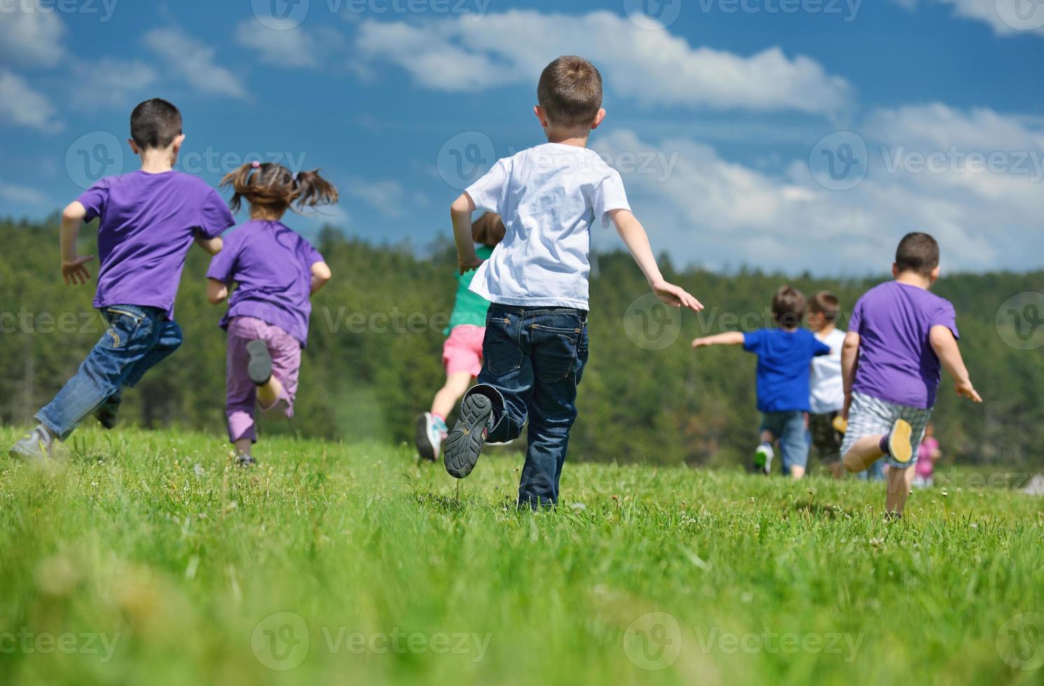 happy kids group  have fun in nature photo