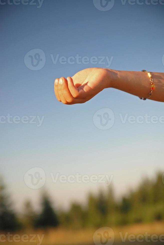 fresh water falling on children hands photo