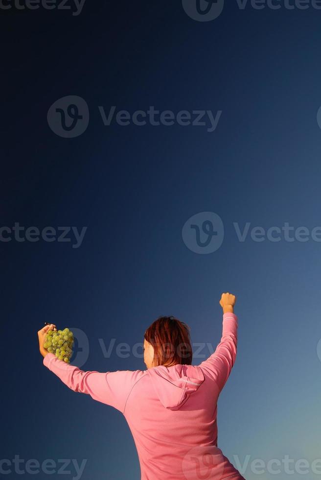 girl with grape outdoor photo