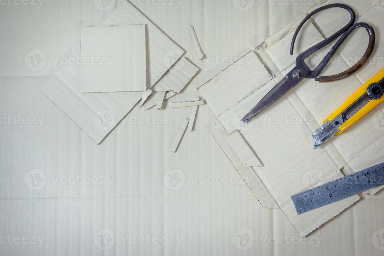 artificial cartons with tool on paper box background photo