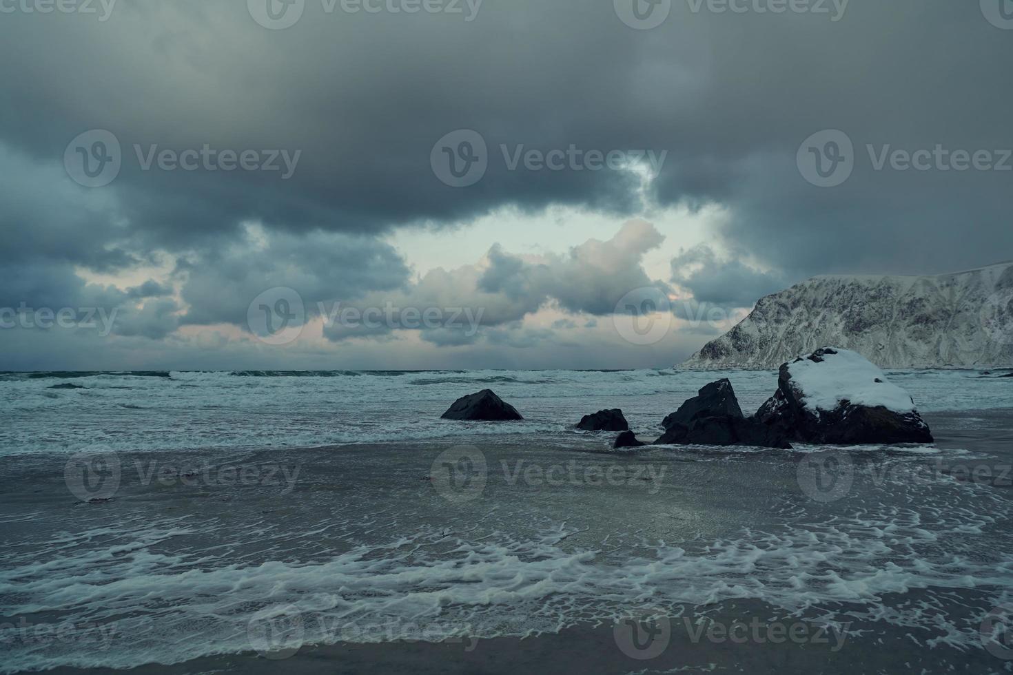 norway coast in winter with snow bad cloudy weather photo