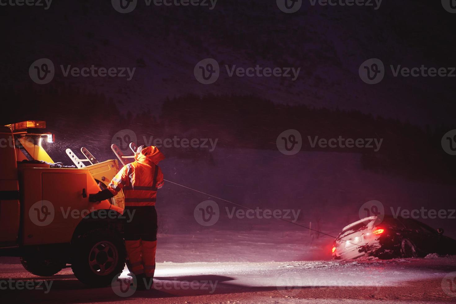 Car being towed after accident in snow storm photo