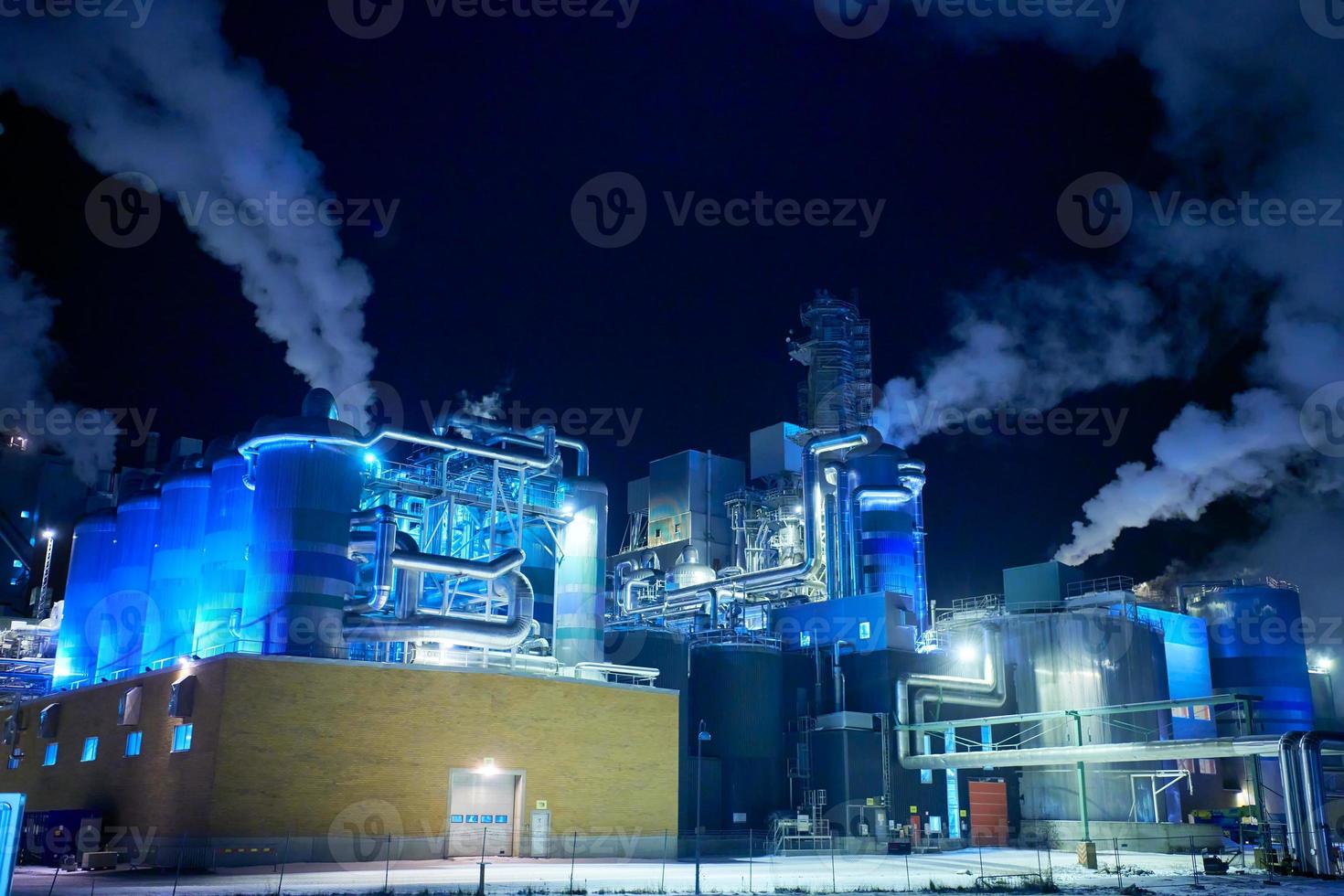 Factory at Night Air Pollution From Industrial Smoke photo