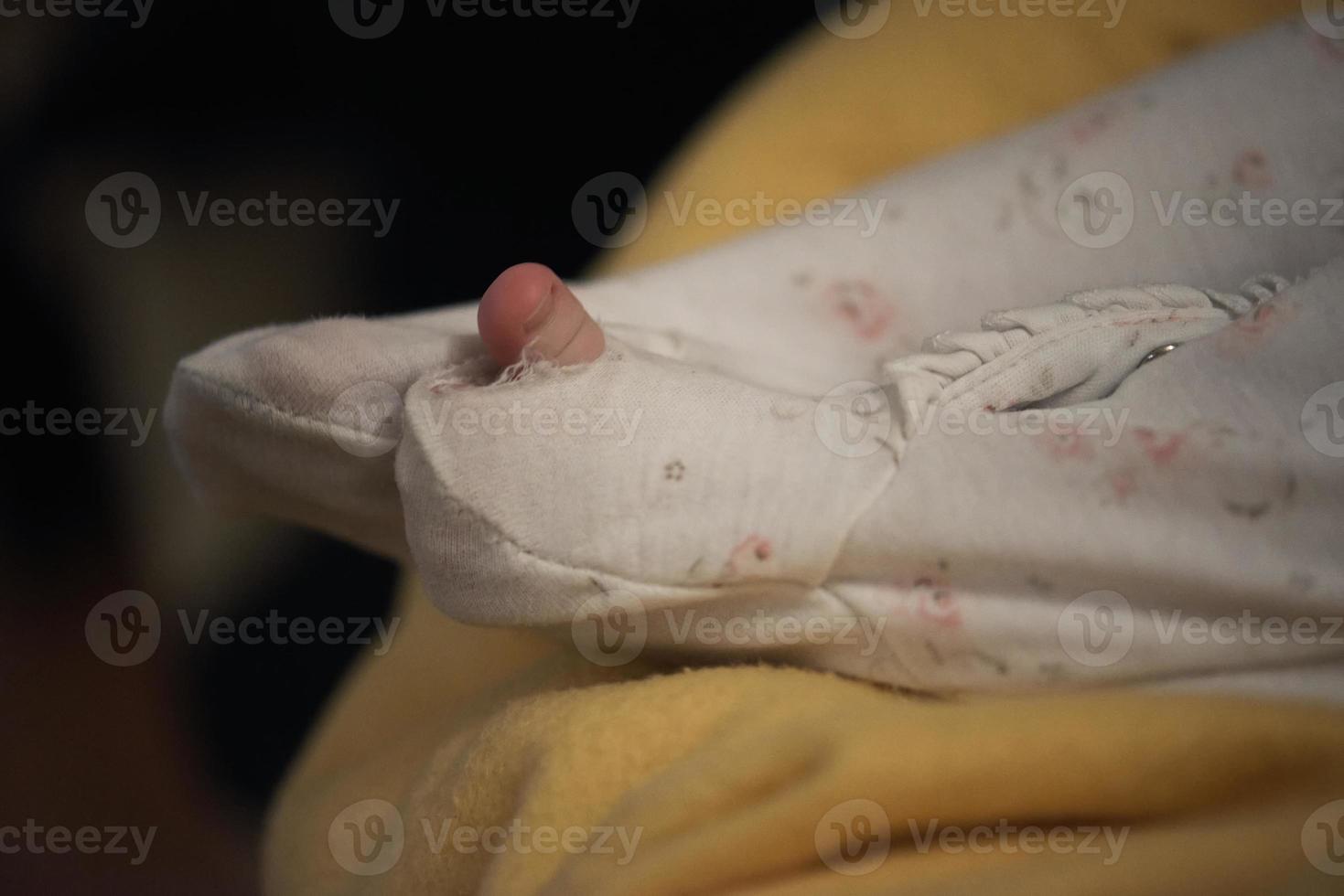 One month newborn baby sleeping  in bed photo