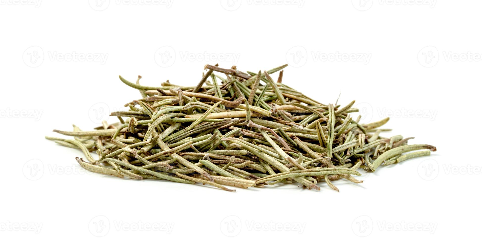 Dry rosemary pile isolated on white background photo