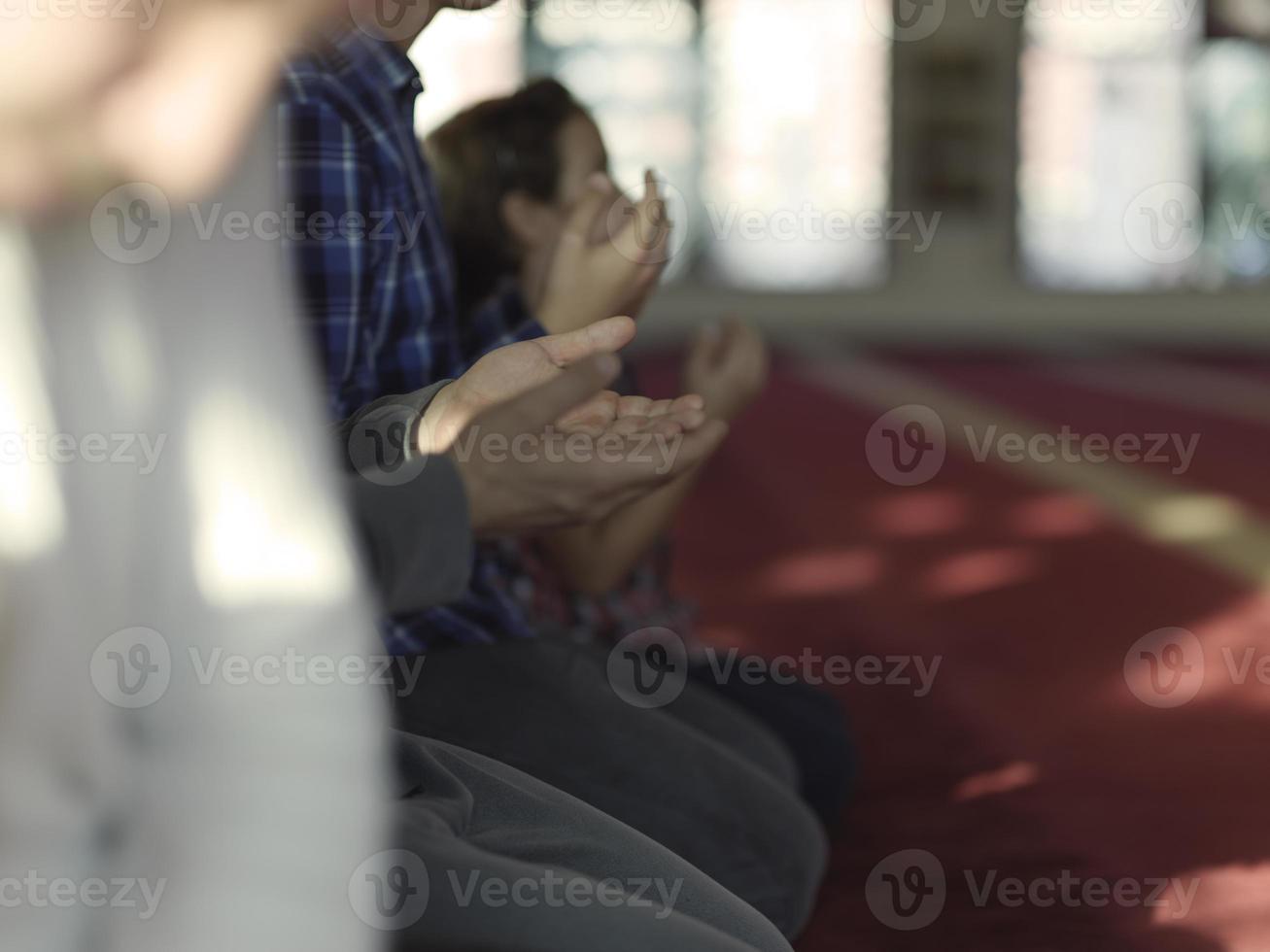 muslim people praying in mosque photo