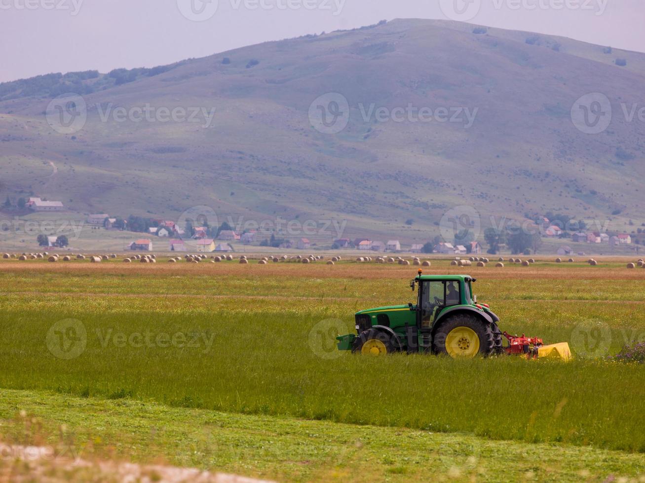 Man driving tractor photo