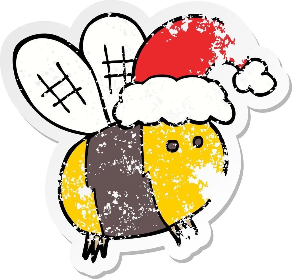 distressed sticker of a cute cartoon bee wearing christmas hat vector