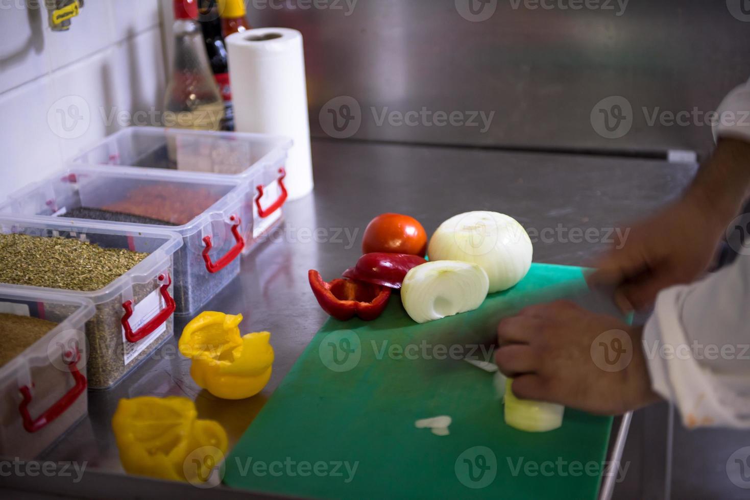 Chef hands cutting fresh and delicious vegetables photo