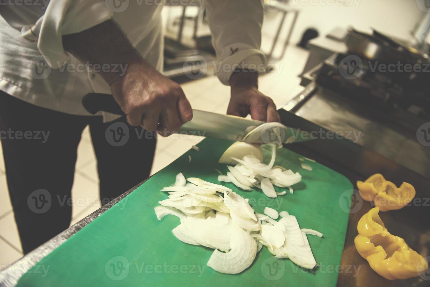 Chef hands cutting fresh and delicious vegetables photo