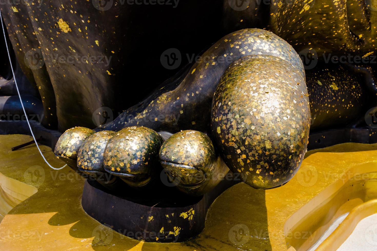 statue monk foot in a temple photo