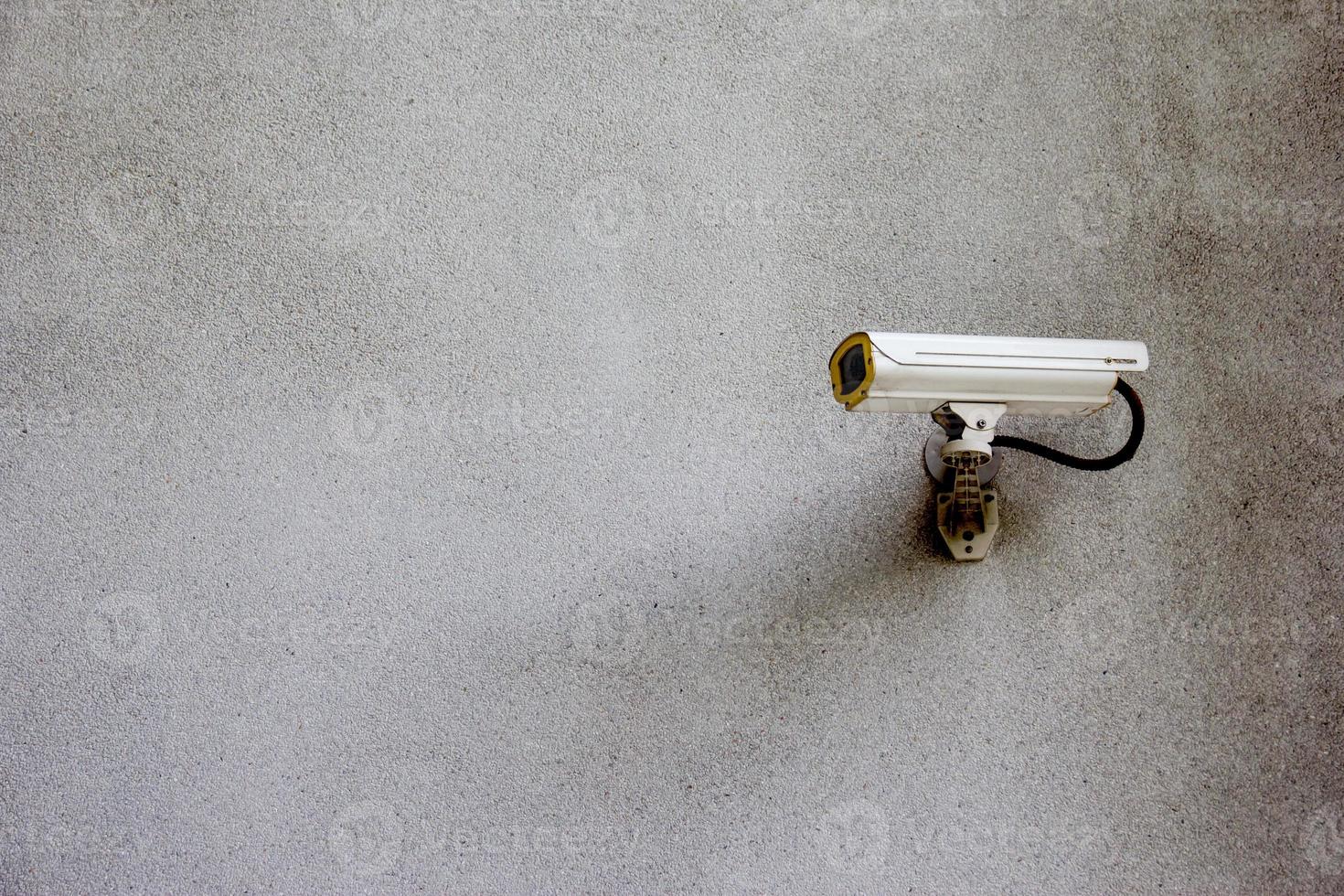 security CCTV camera on wall photo