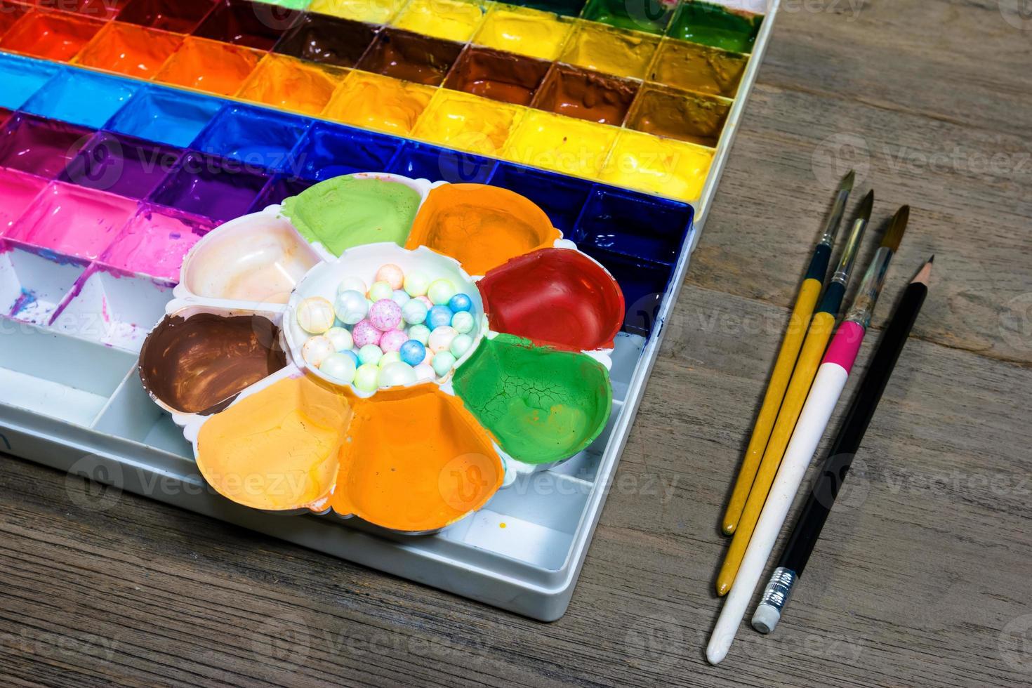 closeup paint tray on wood background photo