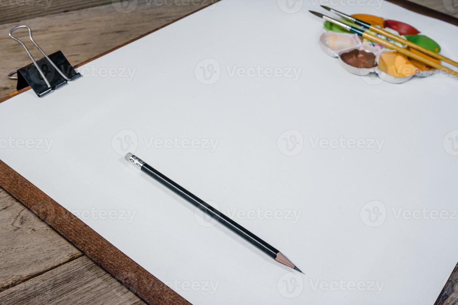 drawing board with paper on desk photo