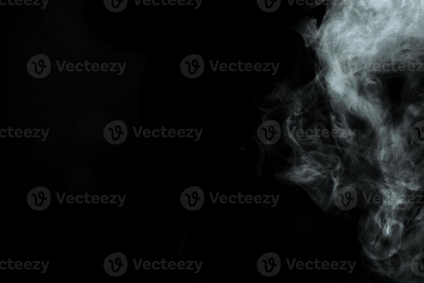 Abstract powder or smoke isolated on black background photo