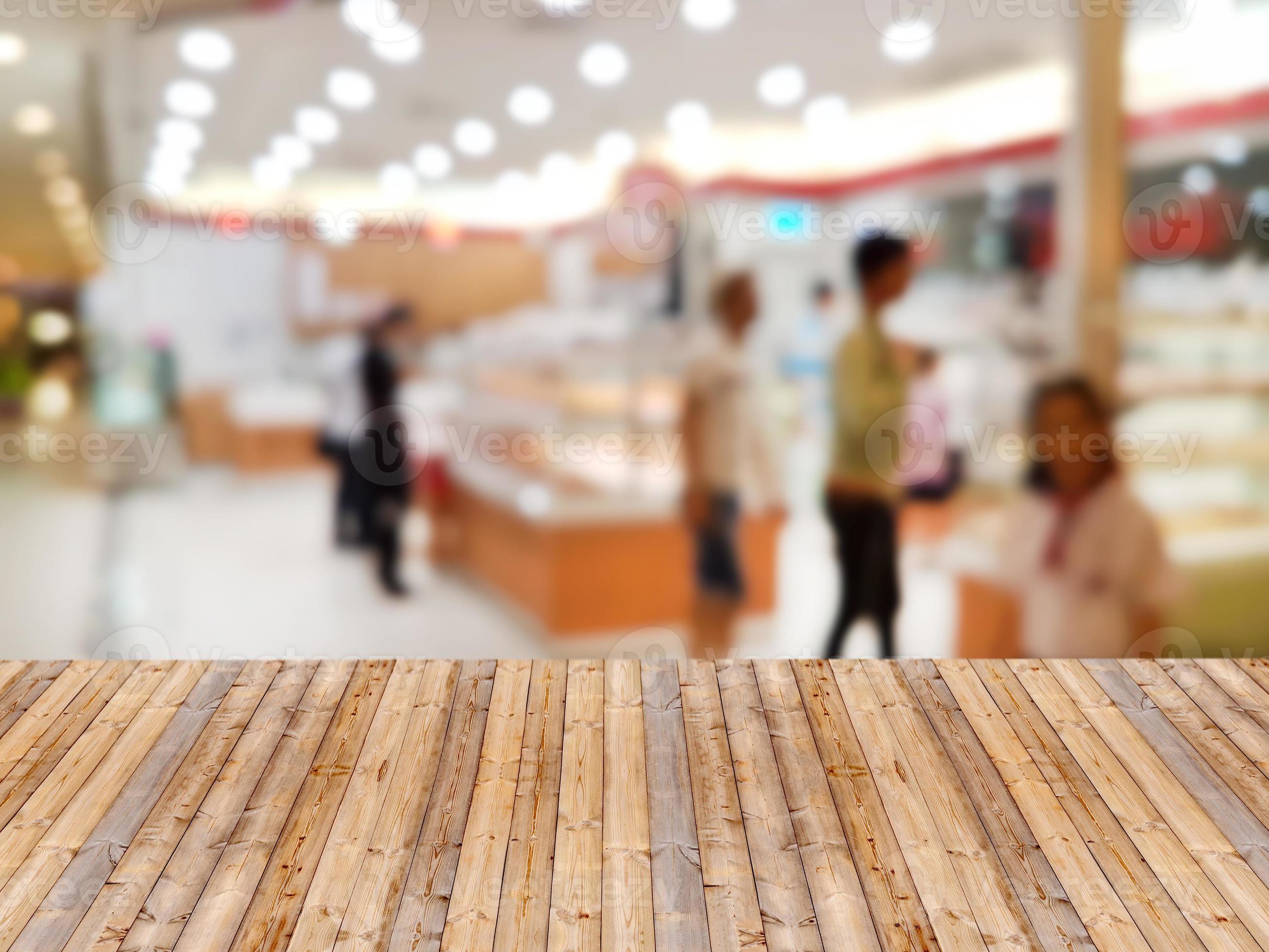 Wooden table with shopping mall blurred background 10739240 Stock Photo