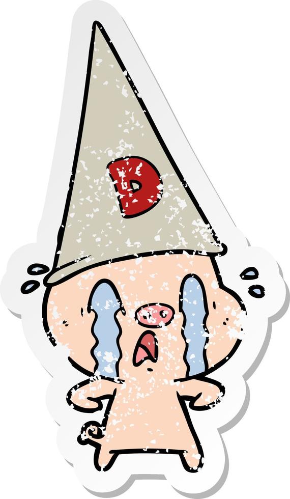distressed sticker of a crying pig wearing dunce hat vector