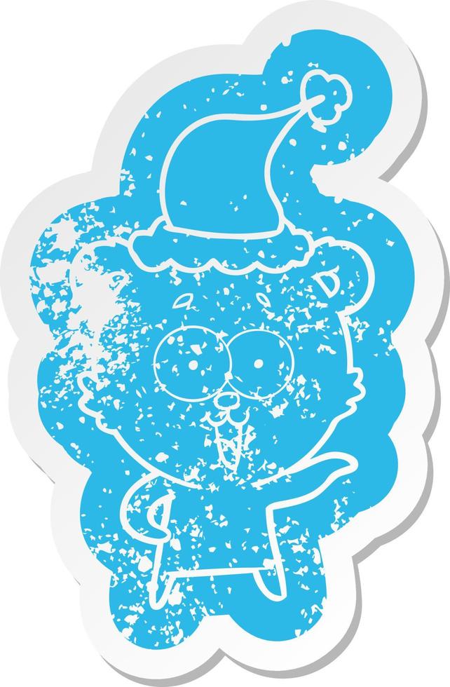 laughing teddy  bear cartoon distressed sticker of a wearing santa hat vector