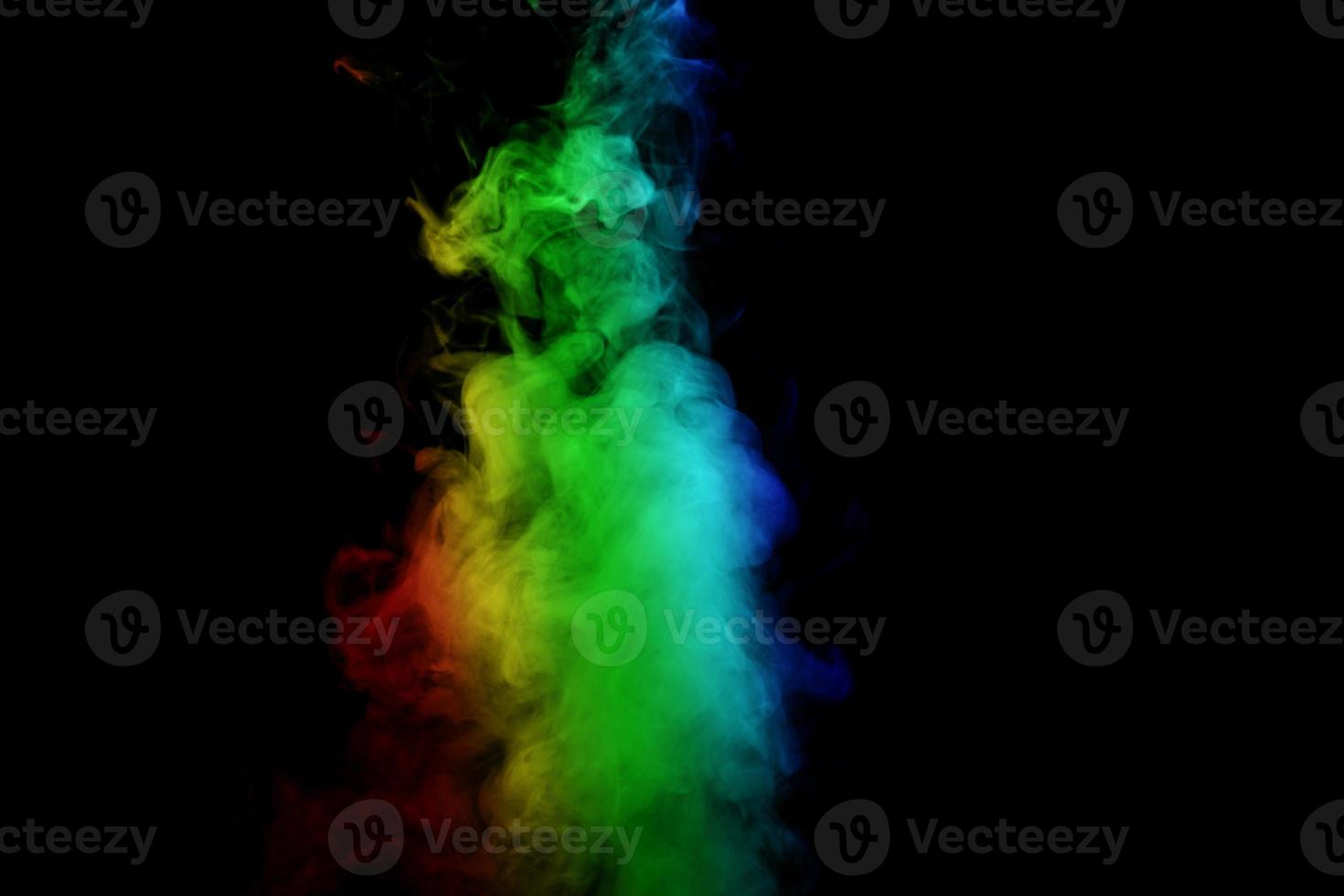 Abstract smoke isolated on black background,Rainbow powder photo