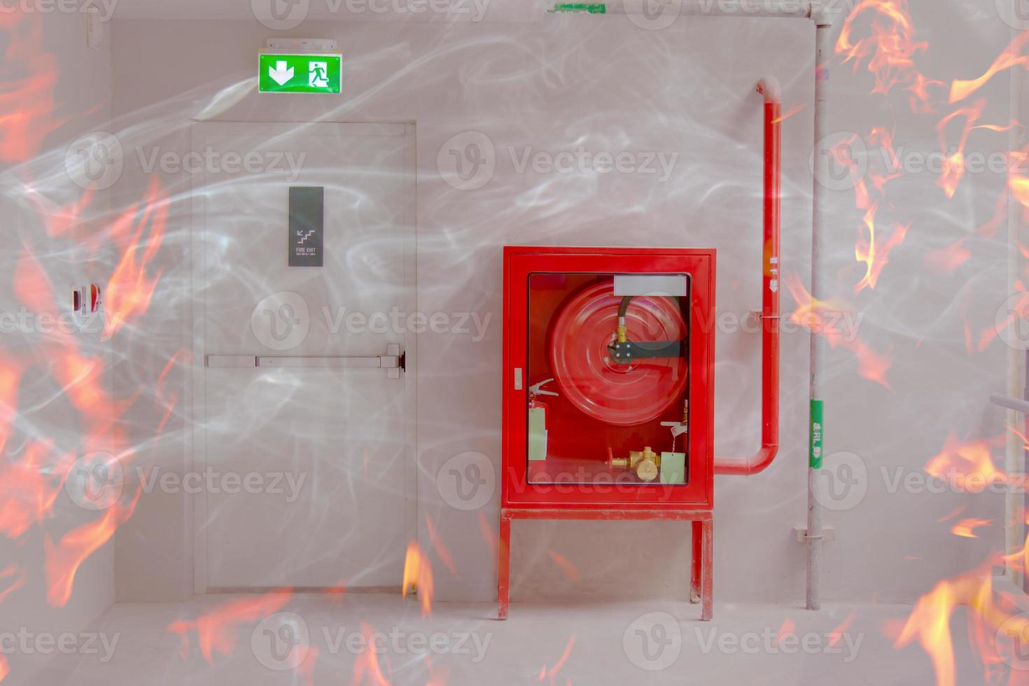 Fire exit door and fire extinguish equipment with flame photo