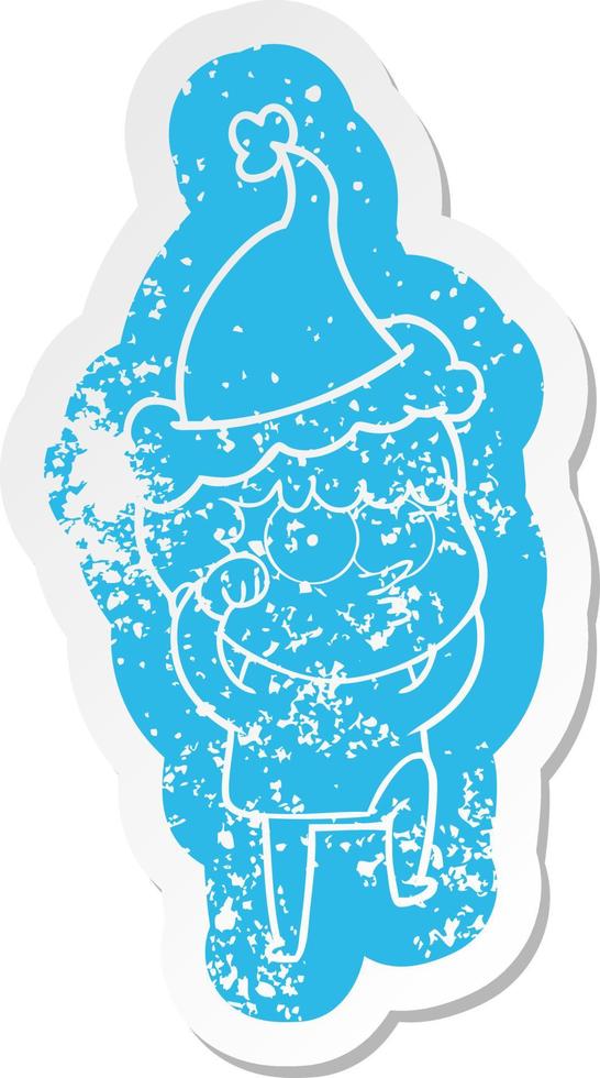 cartoon distressed sticker of a curious boy rubbing eyes in disbelief wearing santa hat vector