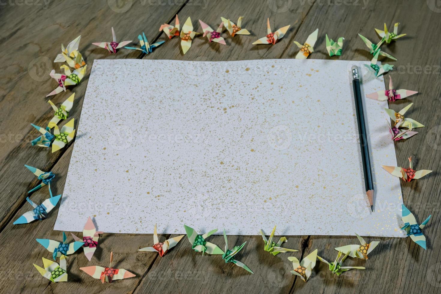 A sheet of paper with a pencil on wooden office desk photo