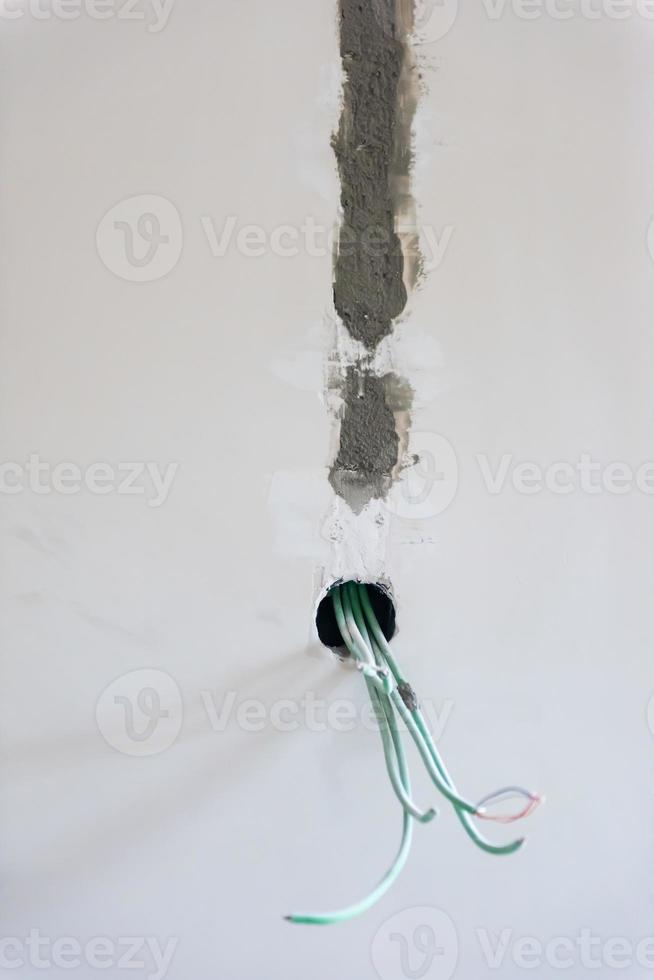 electrical cables on the wall photo