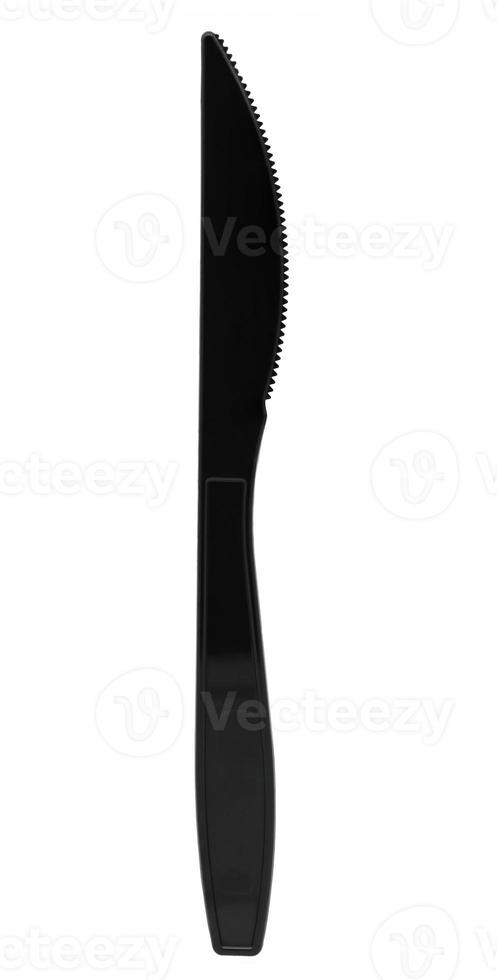 Black plastic knife isolated on white background photo