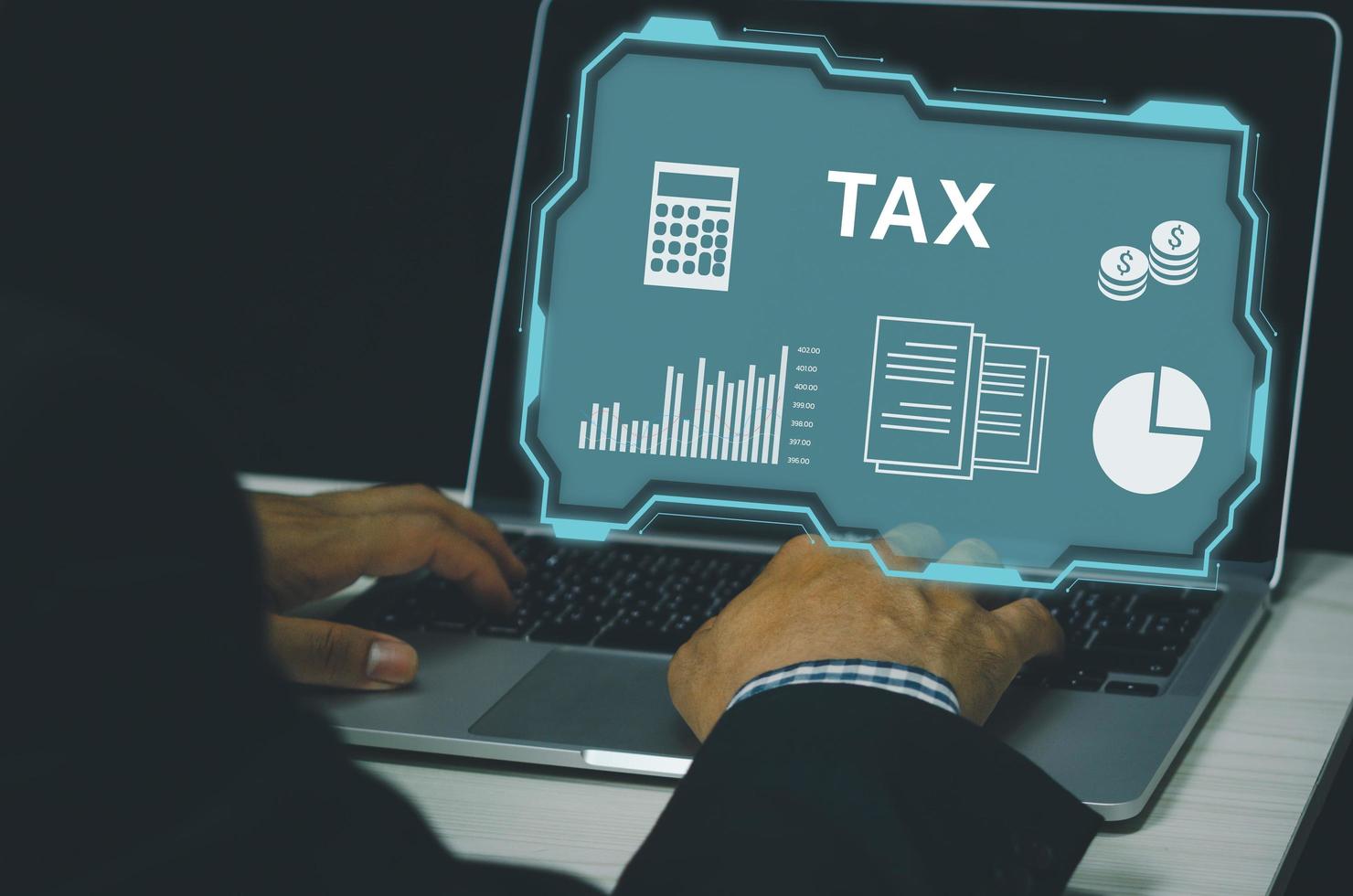 man hand typing on computer laptop icon symbol tax virtual screen Internet Business finance investment payment service digital Technology Concept. photo