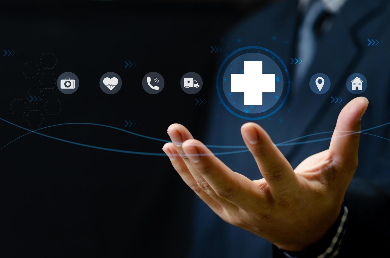 Man hand holding virtual medical health care icons with medical network connection.Business insurance. photo