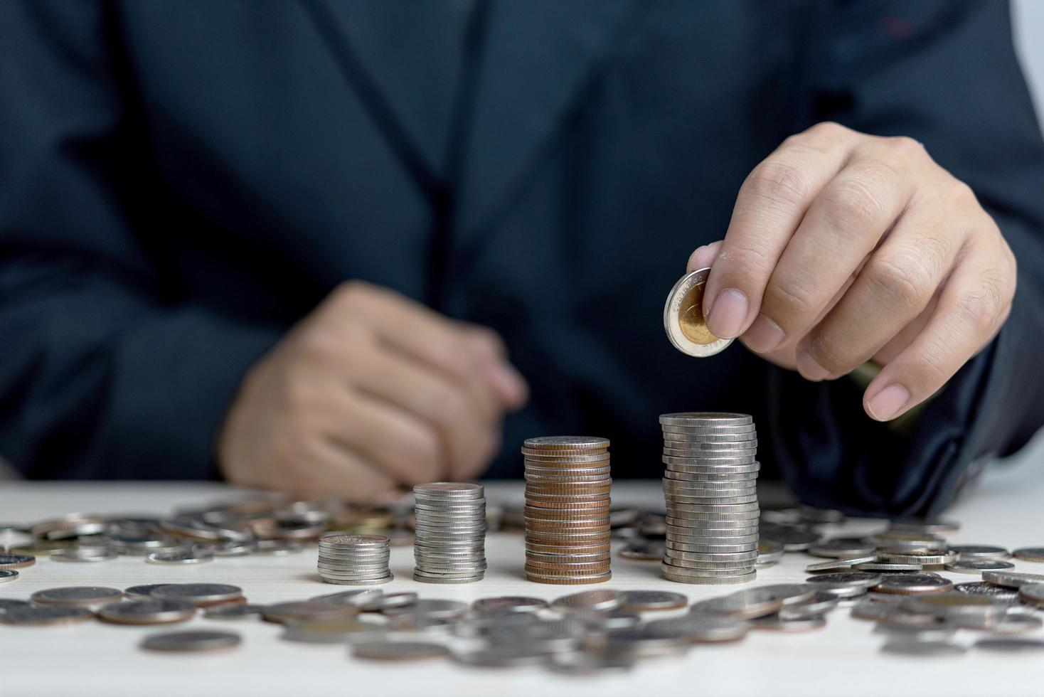 Businessman holding money coin.Business finance investment stock tax and insurance saving concept. photo