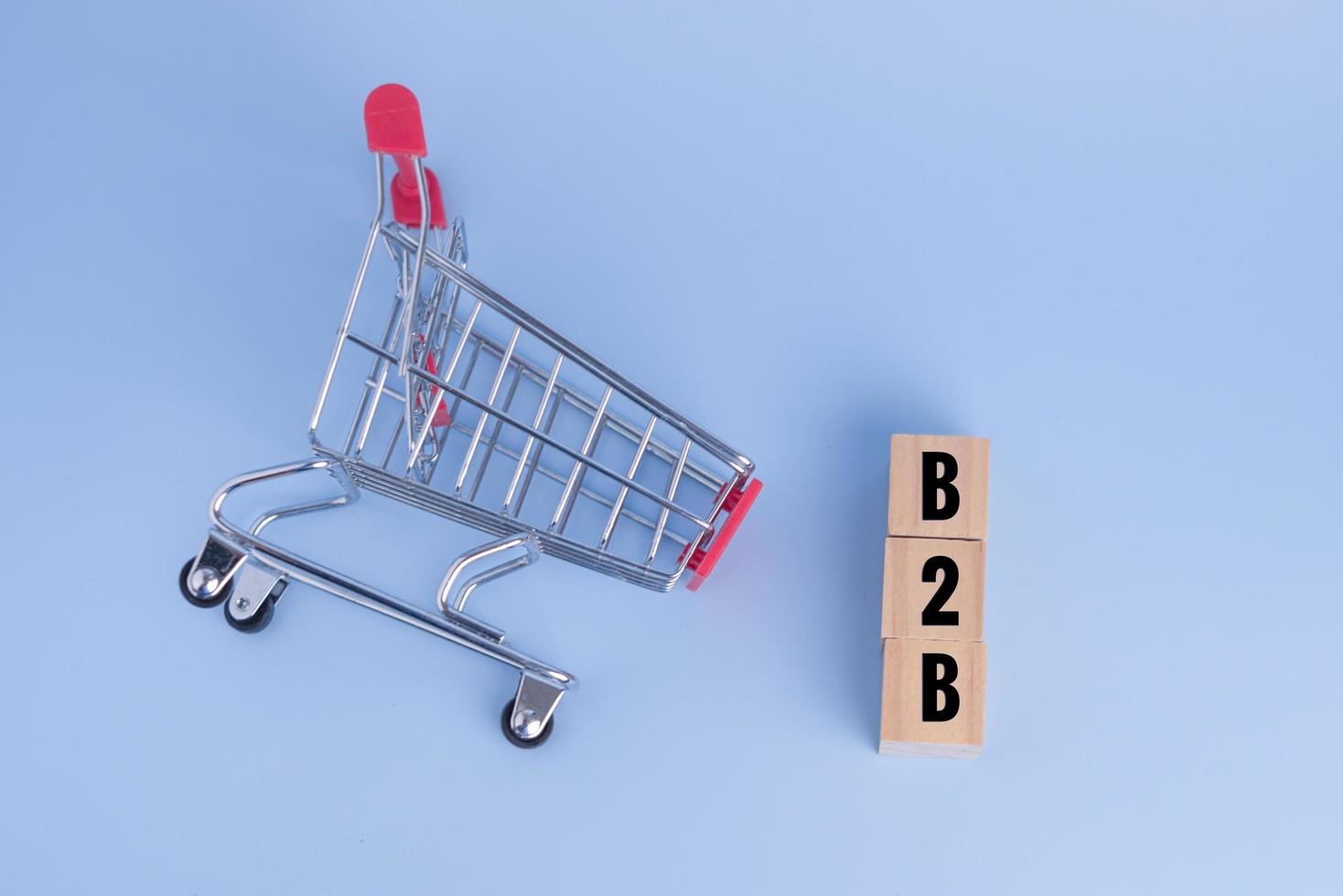 shopping cart wood cube block b2b Business to Business top view concept. photo