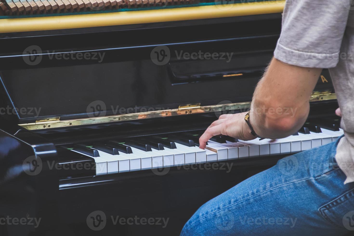 Close up hand Musician playing piano on outdoor. photo