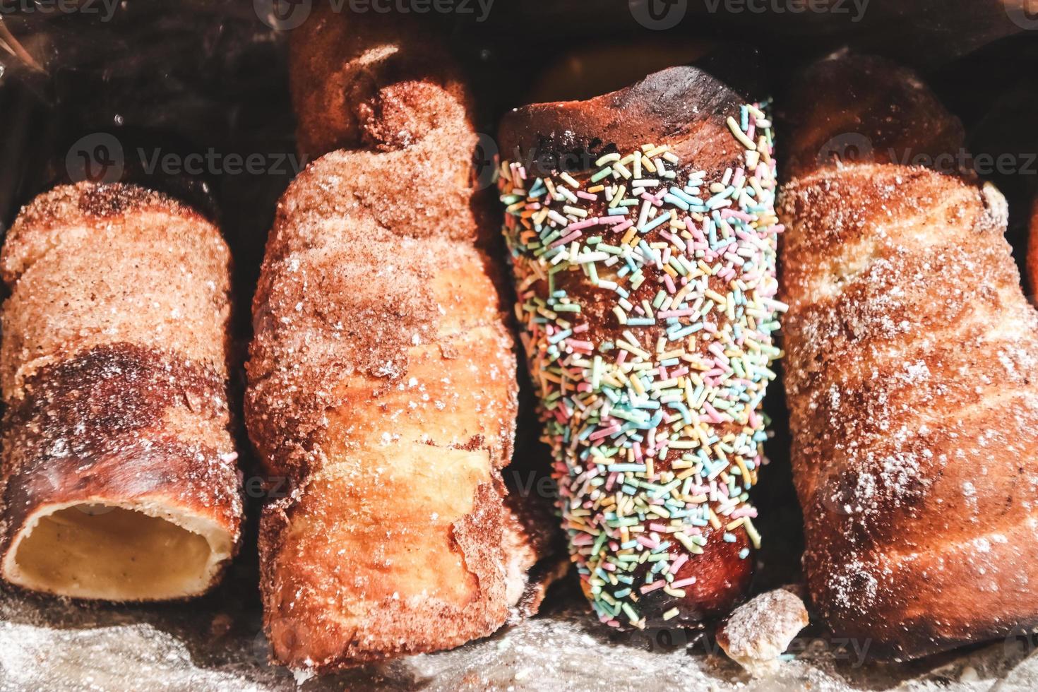 Fresh baked traditional bread and rolls in wicker basket photo