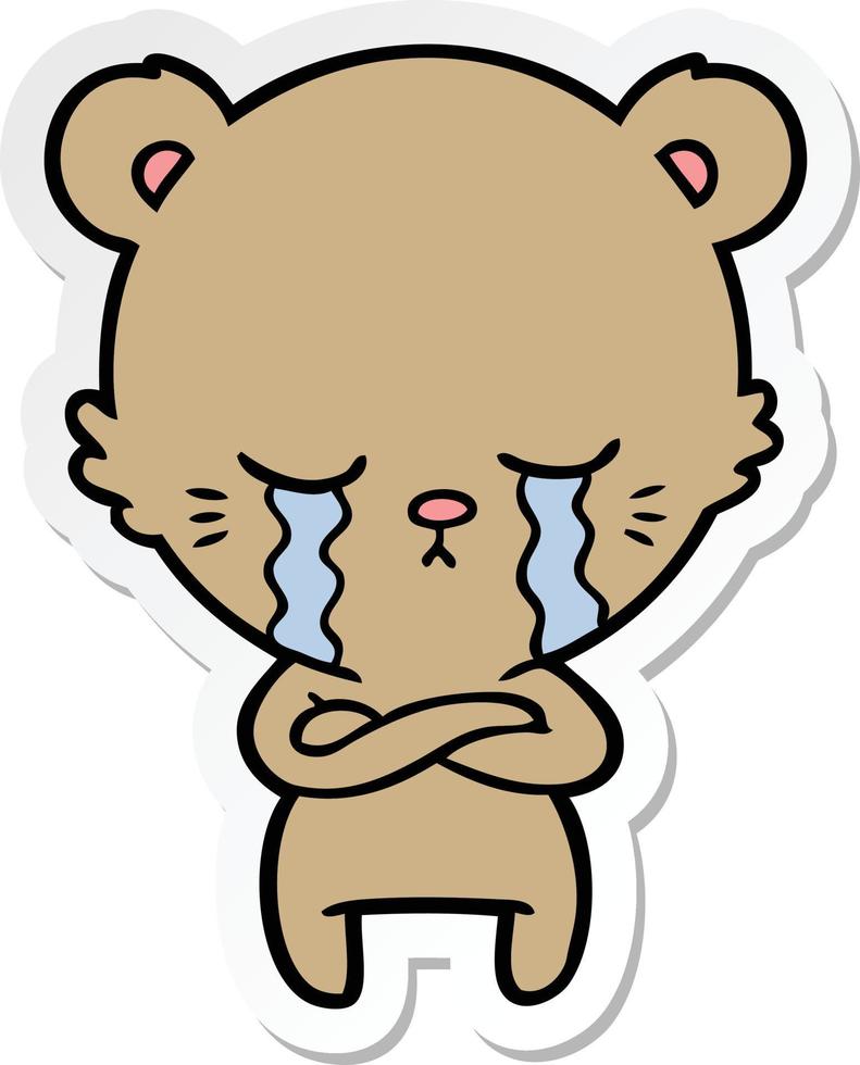 sticker of a crying cartoon bear with folded arms vector