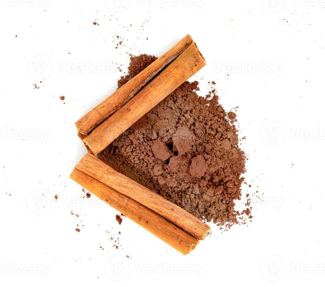 cinnamon powder and sticks isolated on a white background photo