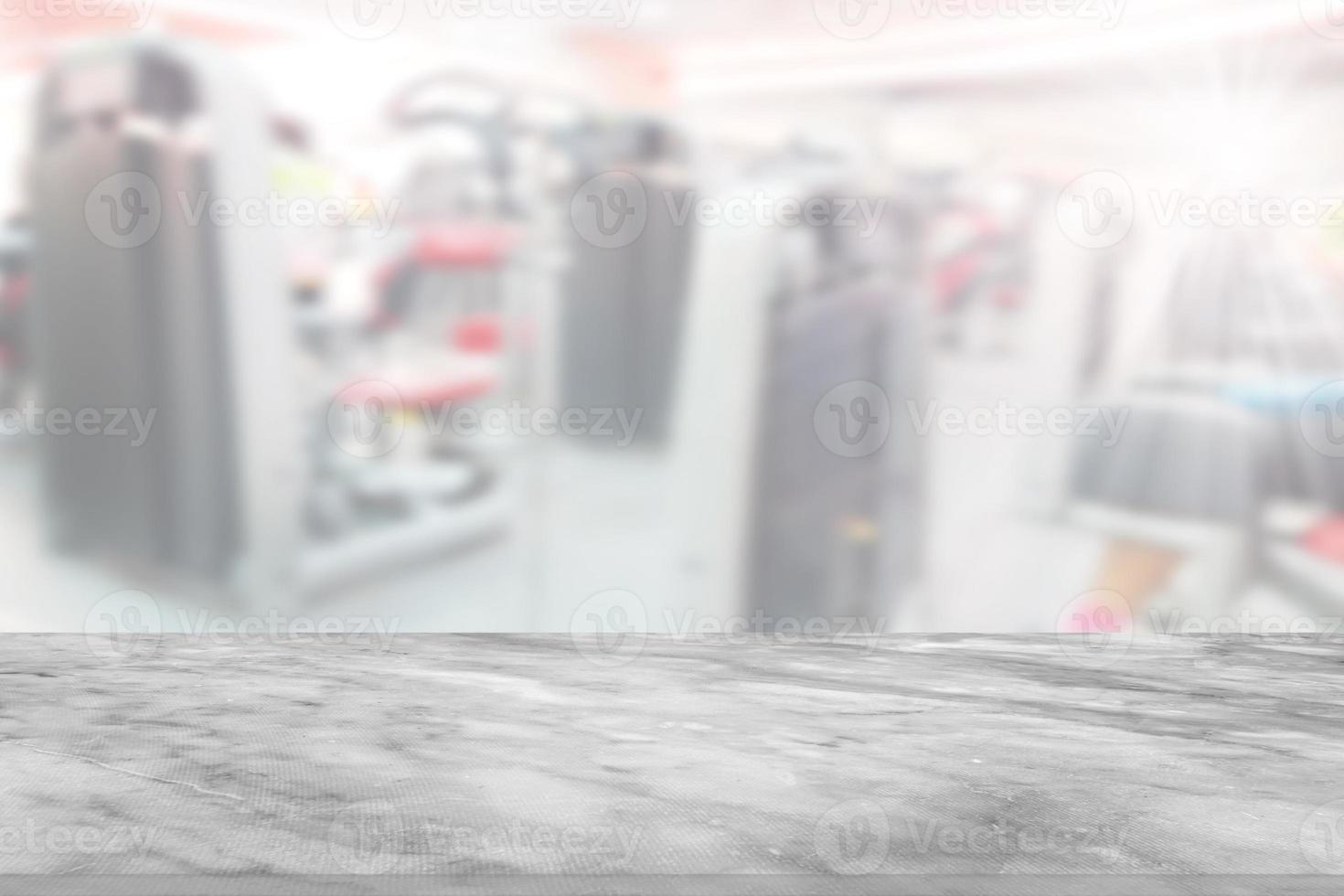 stone table with blur fitness gym equipment background photo
