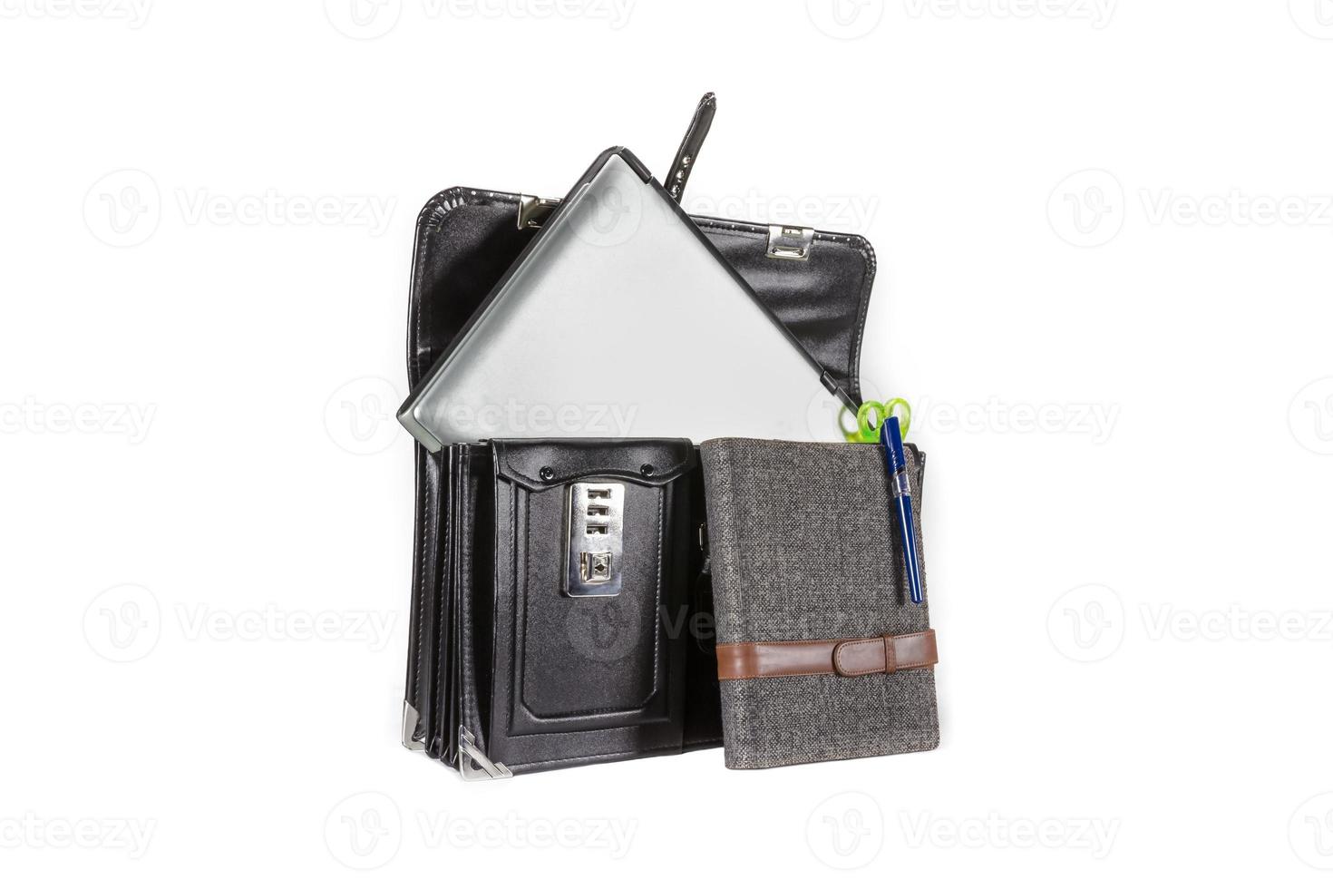 Black retro leather schoolbag with notebook on background photo