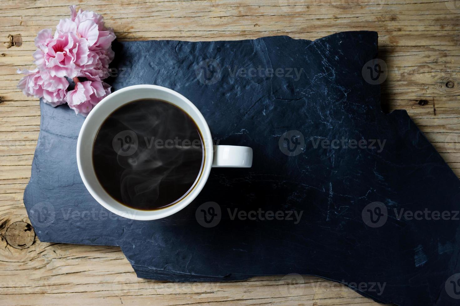 coffee and flower on wood background photo